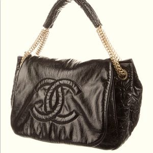 Authentic Chanel Rodeo Drive Accordion bag, black leather / gold hardware